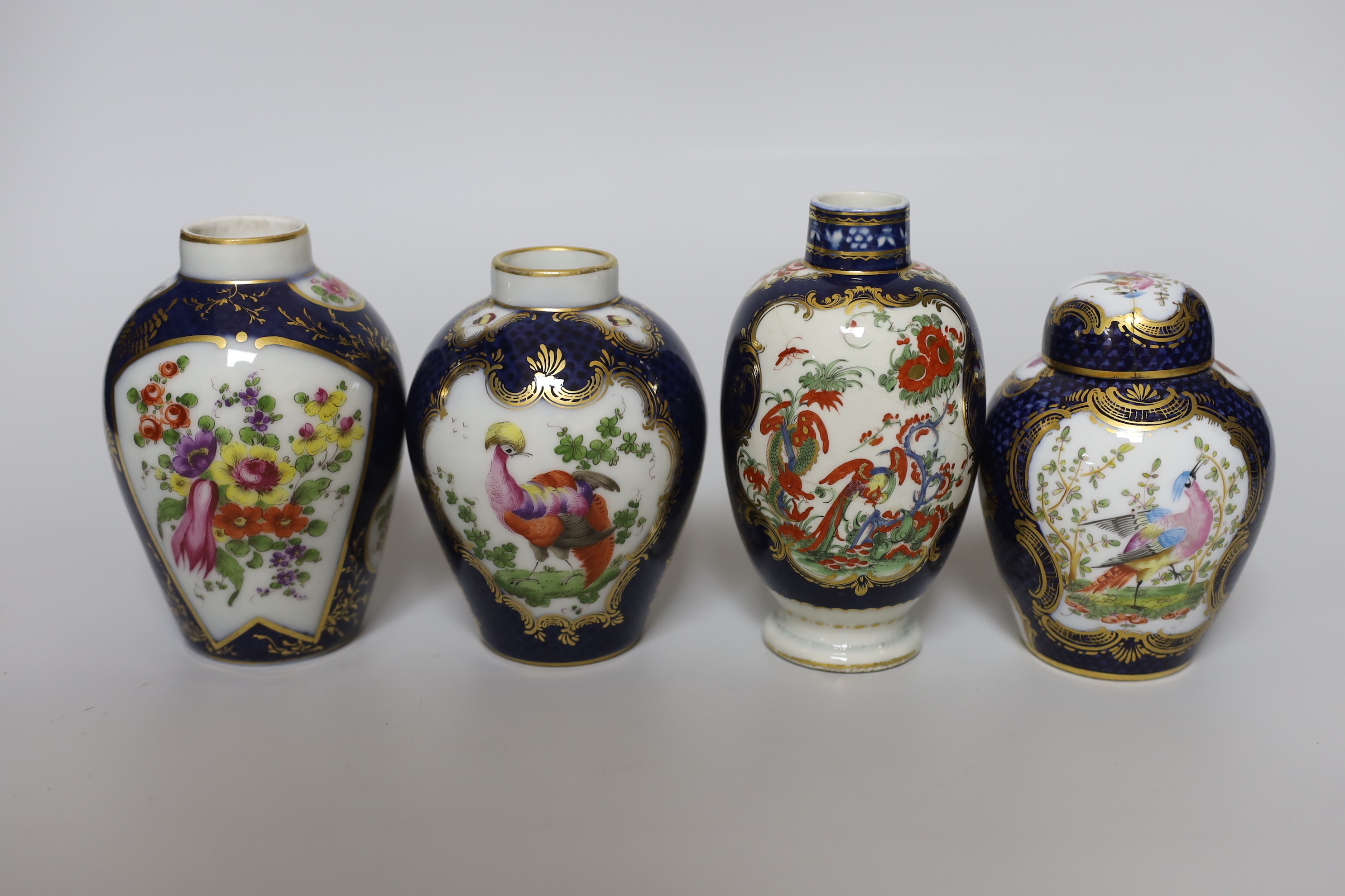 A group of Paris porcelain tea canisters in imitation of Worcester and Sevres, tallest 13.5cm, together with a Worcester Kakiemon pattern scale blue tea canister a/f